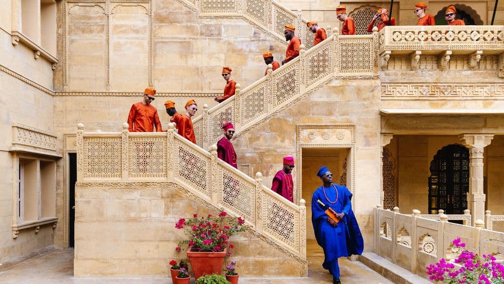 Nigerian wedding scene with guests in traditional dress